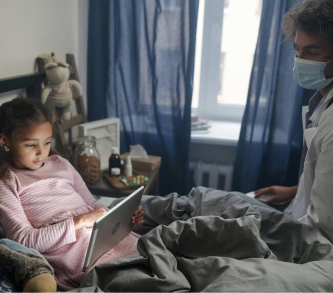 A care worker is taking care a baby