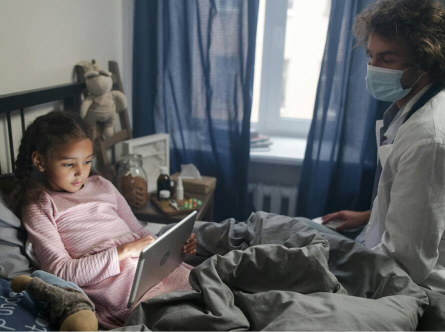 A care worker is taking care a baby